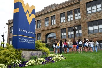The WVU Tech campus with a group of students on the front lawn