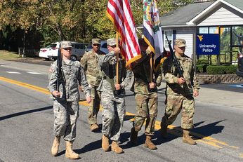 Army ROTC students march in a parade